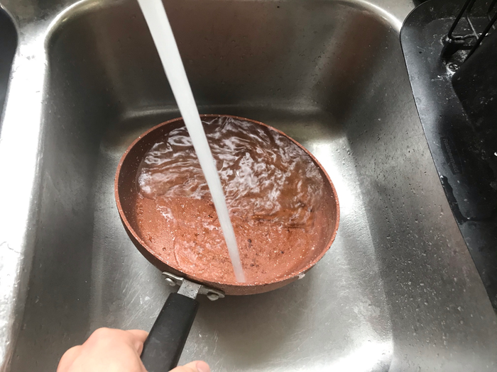 Rinsing with hot water.