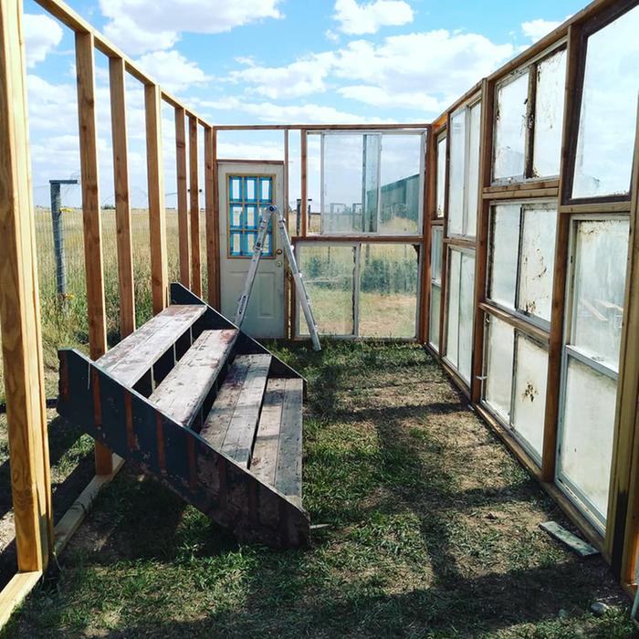 building of a greenhouse from repurposed windows