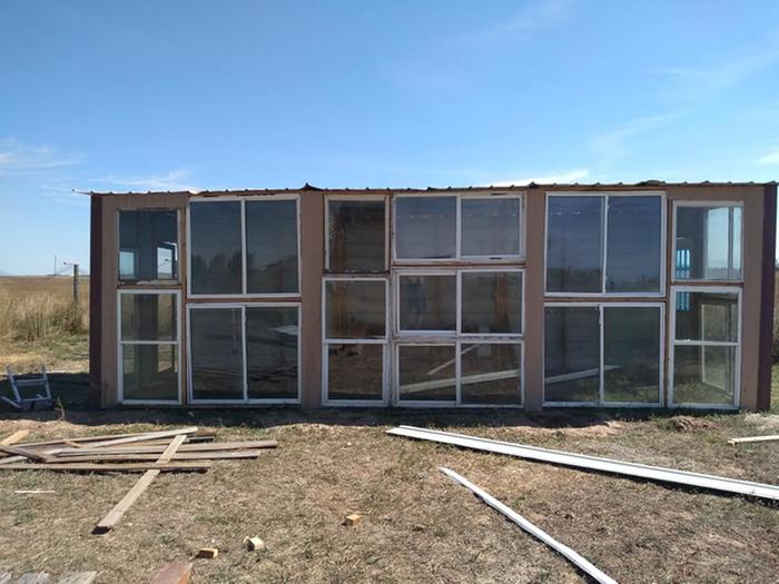 front view of greenhouse made from repurposed windows