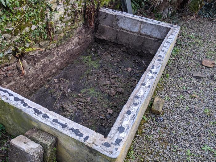 Inside of the pond. Breeze block construction