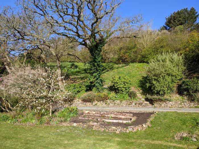 General context above a veg bed I made last year. You can get some idea of the bank and whats beneath it. There is a small flat(ish) area above that retaining wall, then the vertical piece and into the slope