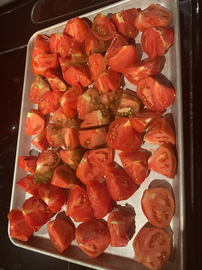 sheet pan with fresh cut tomatoes