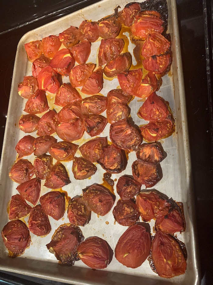 sheet pan with roasted tomato chunks