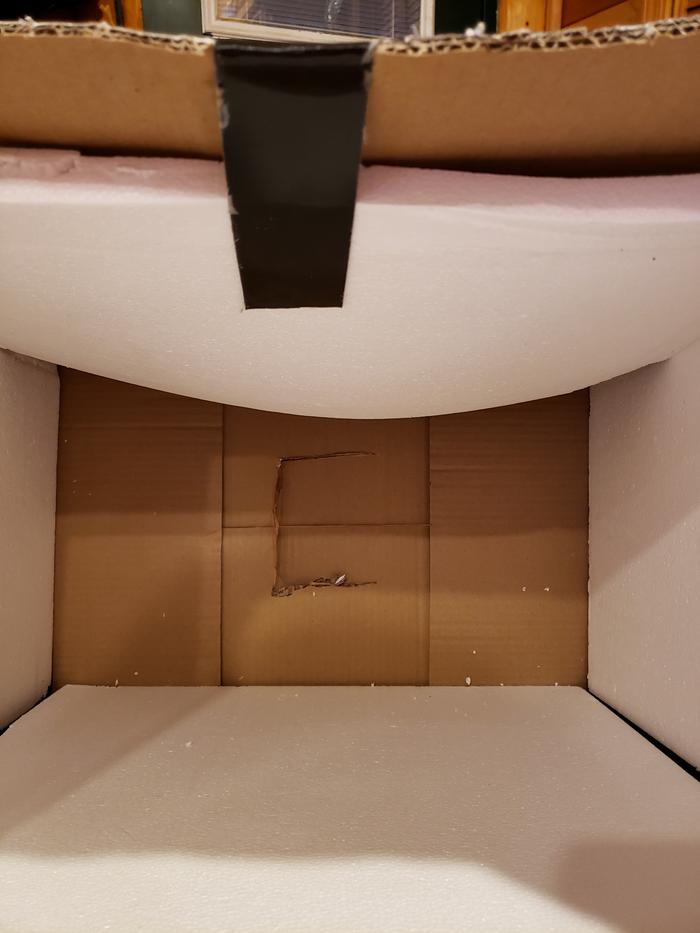 Styrofoam inside the box, hole in the top fort the chain