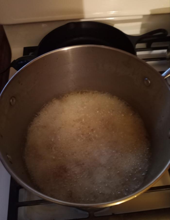 water evaporated and duck skin frying in duck fat.