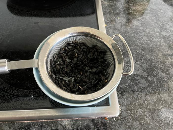 sunflower seeds in a collander ready to sprout