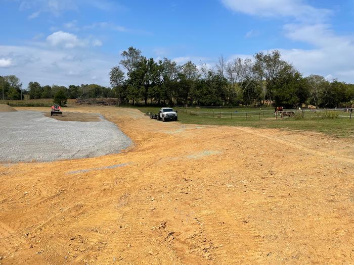 North side of arena (arena is gray, area for seating has just been seeded)