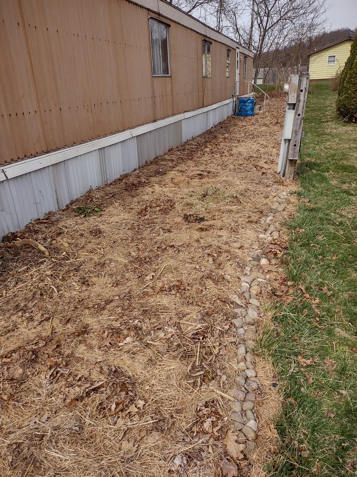 side-yard-covered-with-fall-leaves-and-hay