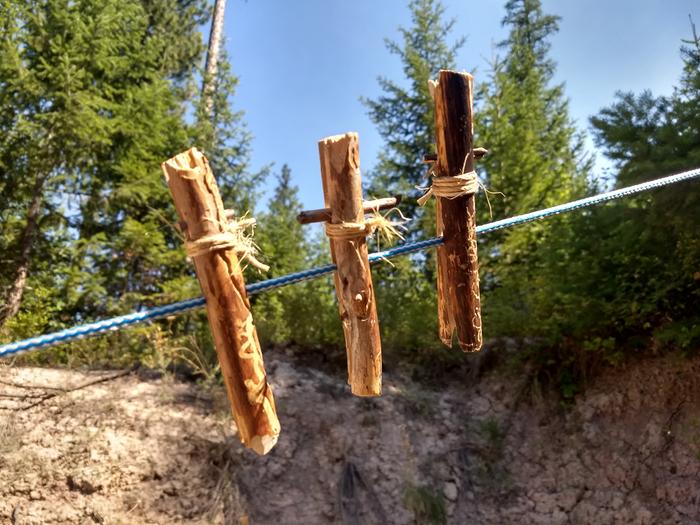 Three pins on a clothes line