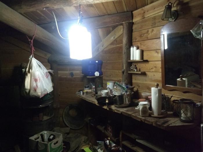 Kitty litter container filled with water, lit by a bike headlamp