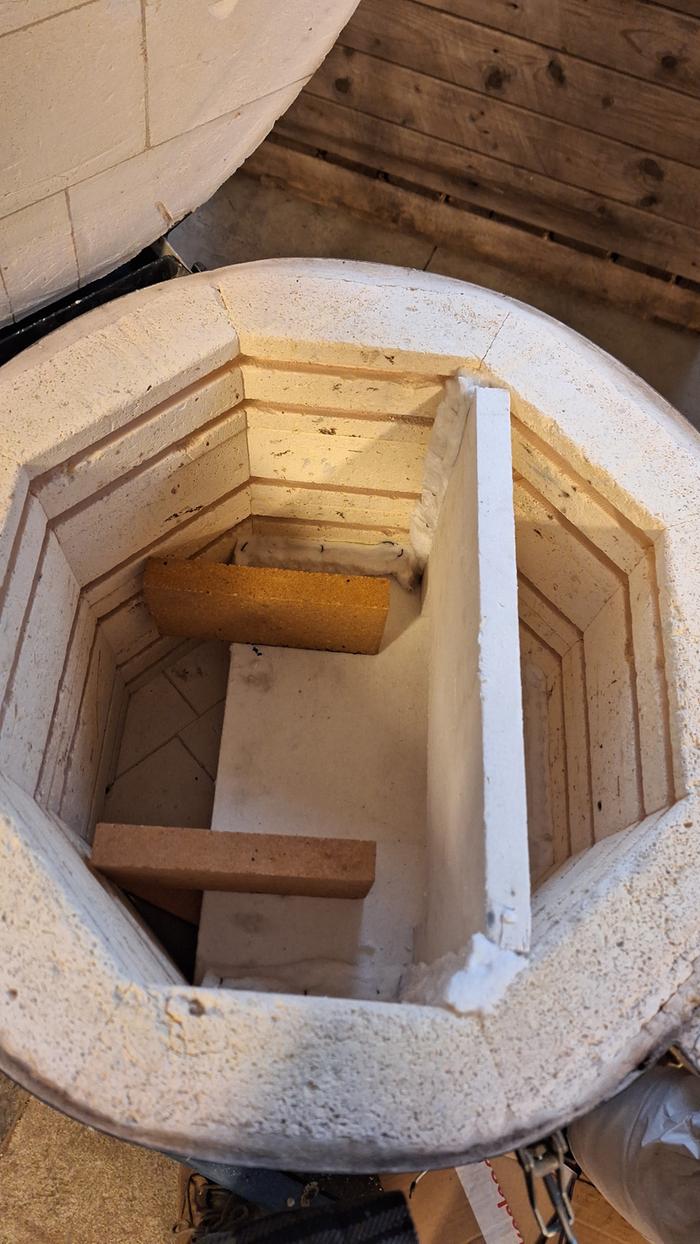 A shelf and baffle to keep hot gasses in a pottery kiln