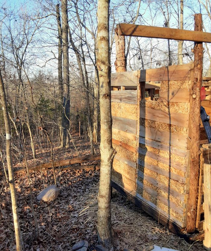 Light clay straw infill wall with a beam above it