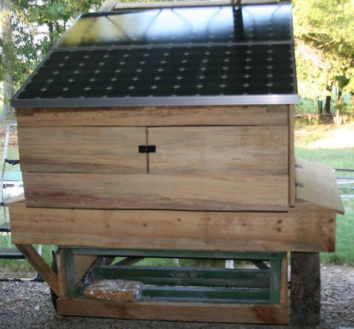 solar panels mounted on roof of mobile coop