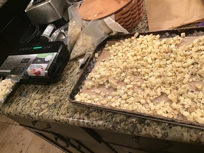 Sweet potatoes, cubed and frozen loosely on a cookie sheet