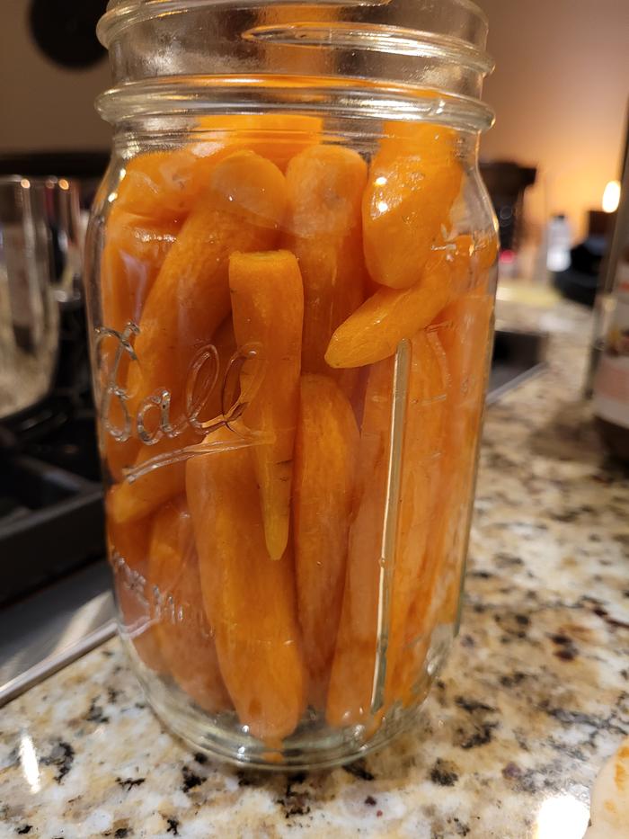 Carrots packed in the jar.