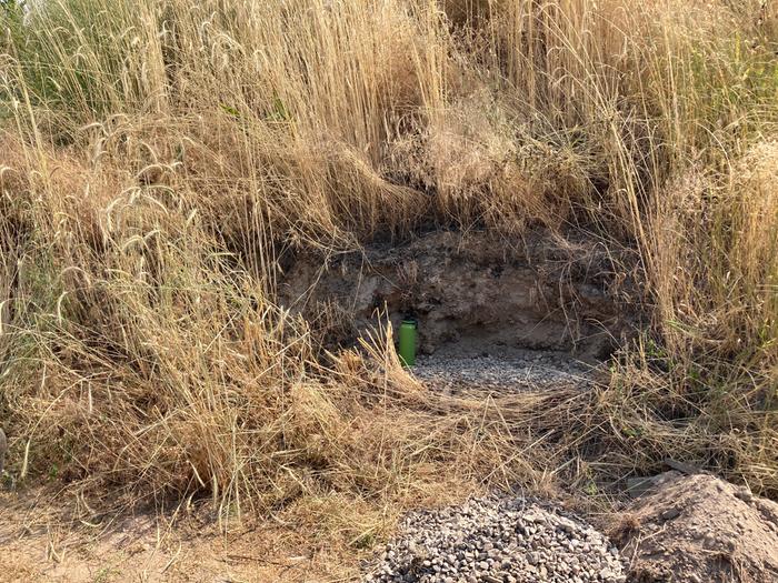 Cut into hugel; leveled the base with compacted gravel for drainage