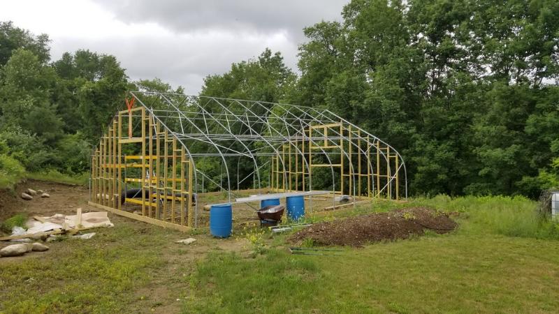 bunch of drainage tubes and insulation buried under the greenhouse for thermal banking