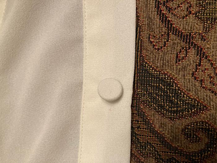 button resewn onto blouse