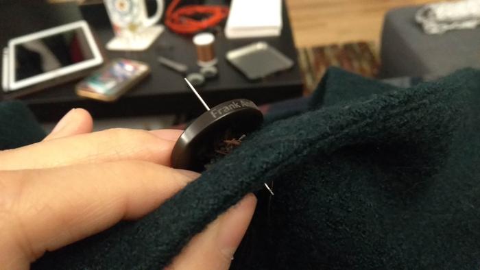 sewing on a button