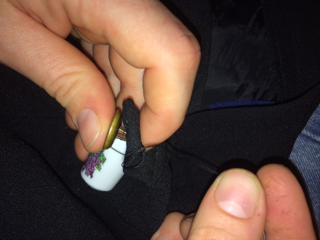 sewing on a button