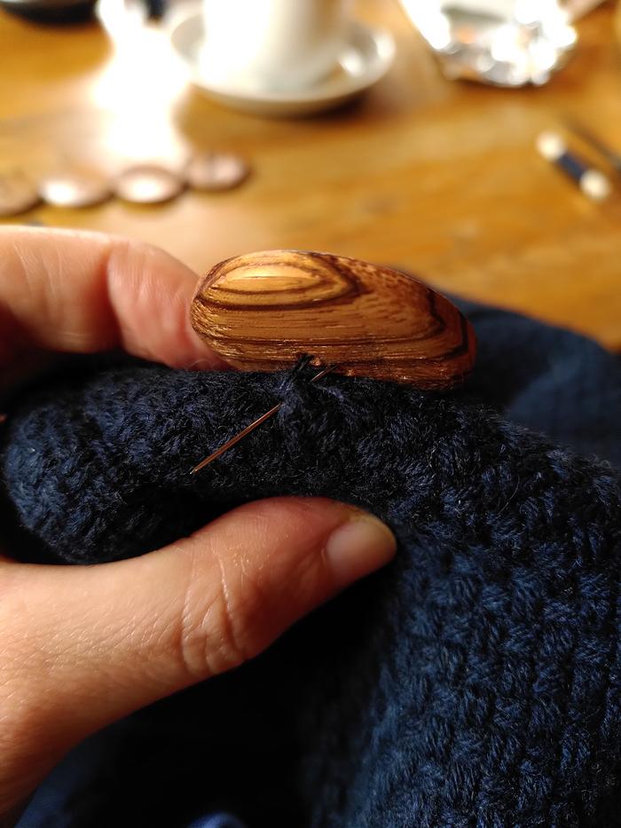 Sewing on the button - process picture