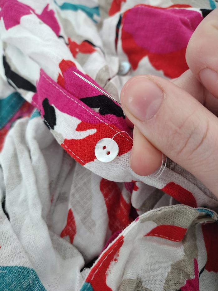 Sewing on the button