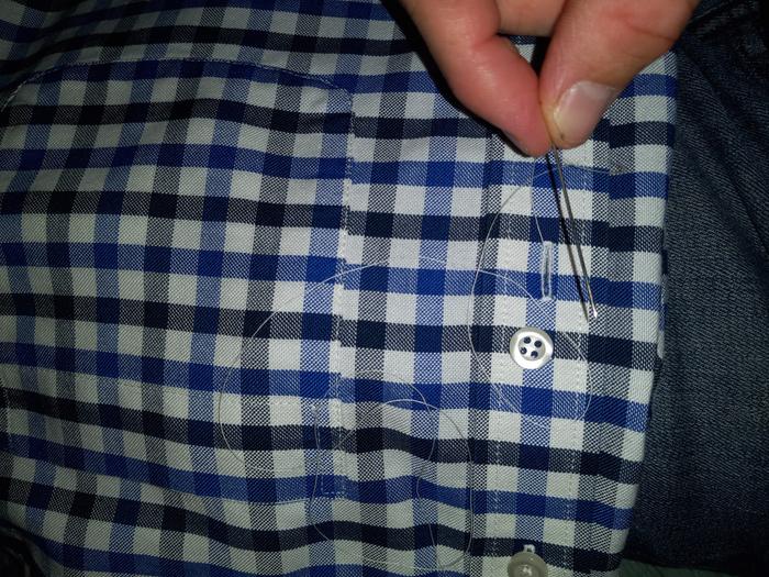 Thread, button, and shirt.