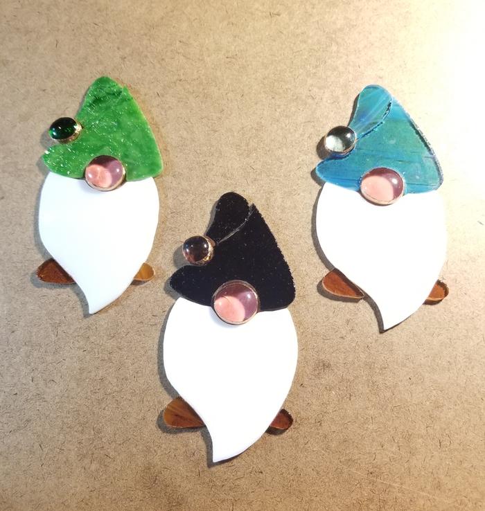 glass cut out for a series of gnomes