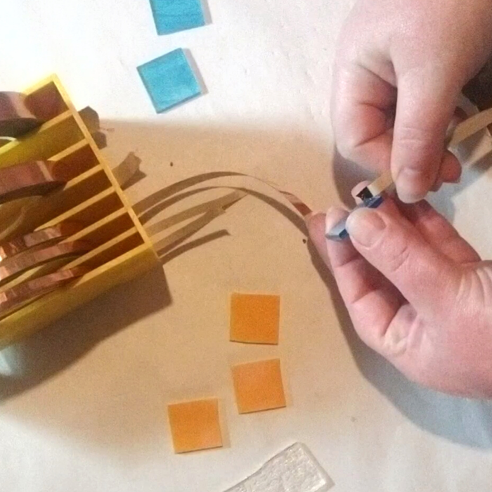 process of wrapping foil on glass for the whirls