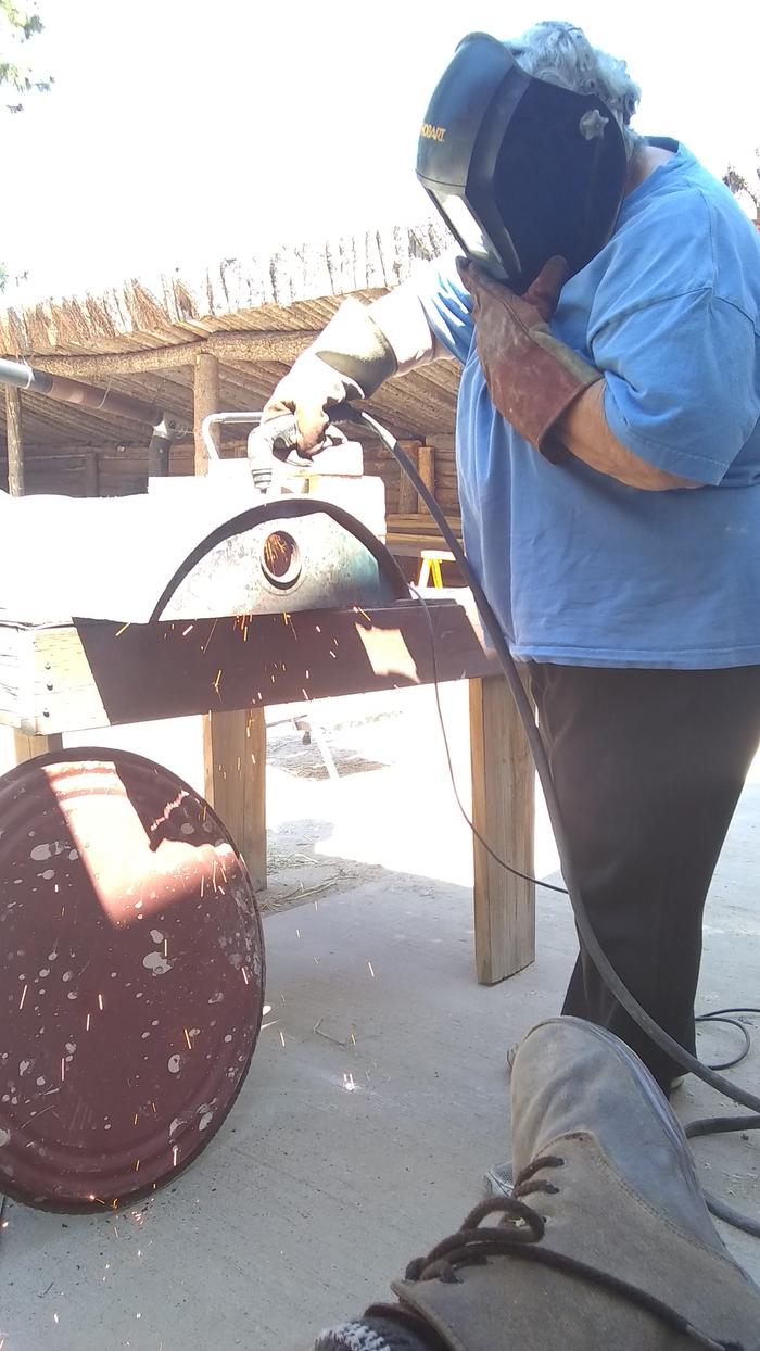 Mary learning to use the plasma cutter