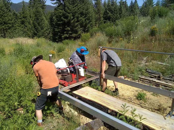 The crew learning to use the sawmill