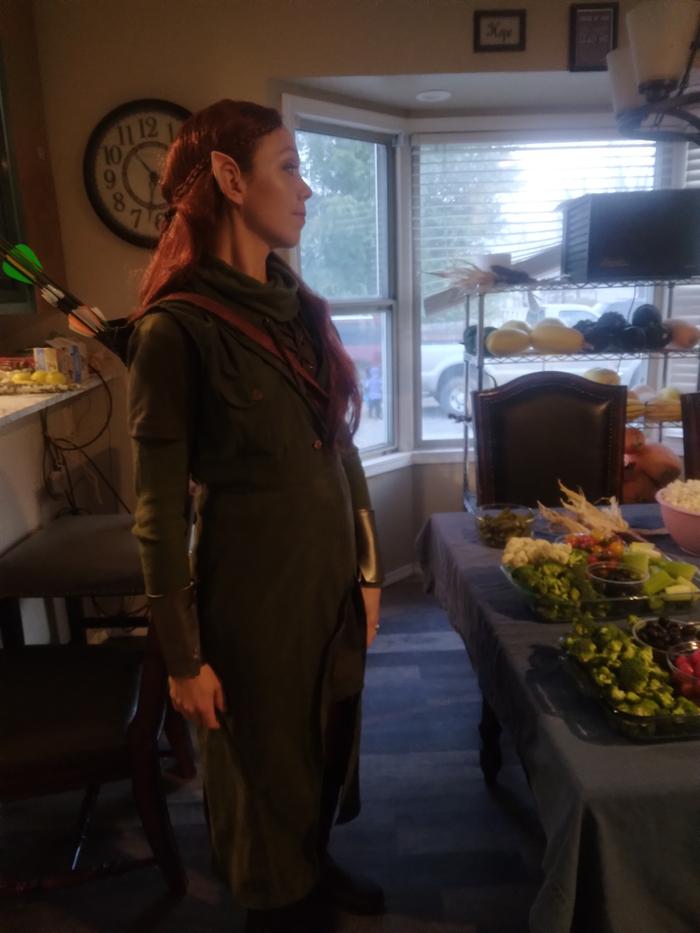 Tauriel the elf, setting desserts on the table