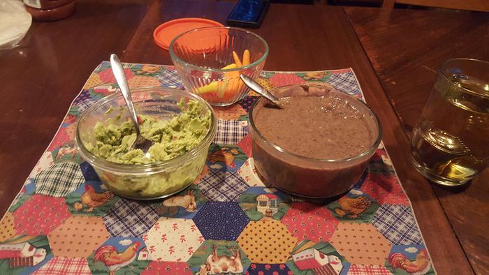 Freshly made guacamole and black bean jalapeno pur&eacute;e with tortilla chips for dinner