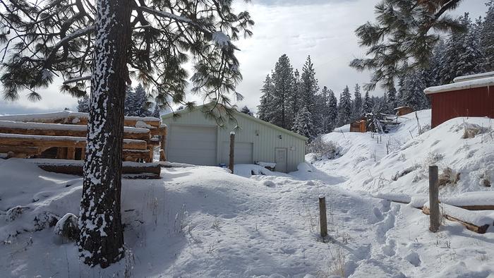 (from left to right) Beautiful shot of berm shed (under construction), shop/auditorium, willow bank, showers, &amp; red cabin