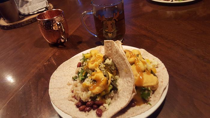 Nettle Tea &amp; Tacos (organic wheat tortillas, brown rice, pinto beans, jalapenos, bell peppers, roasted green beans &amp; cauliflower, habanero sauce, vegan queso, and guacamole)