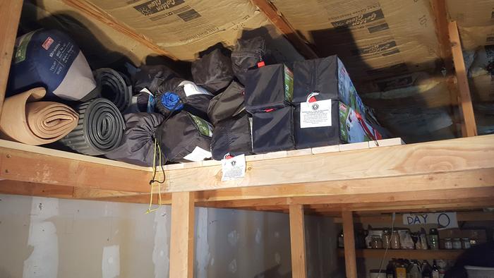 Storing camping supplies on the new shelving