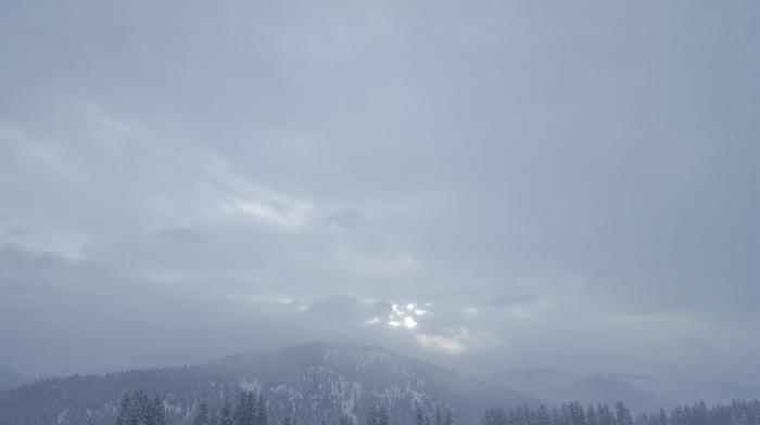 Winter sun rising, beautiful mist over the mountains