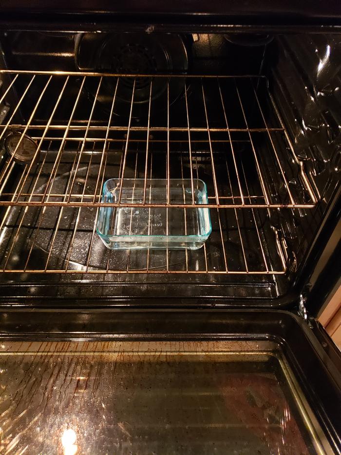 Oven at 450 with water pan in bottom for steam