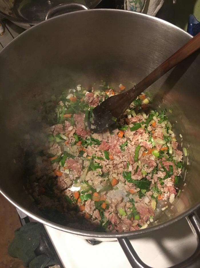 in the pot after adding sausage