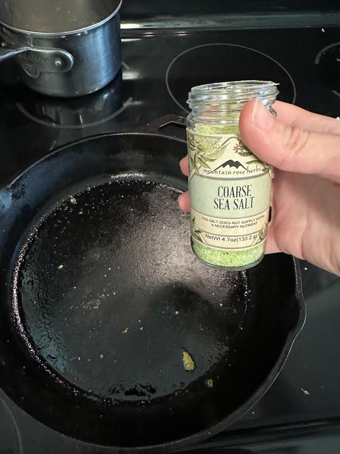 putting some coarse salt on the pan to get the small bits