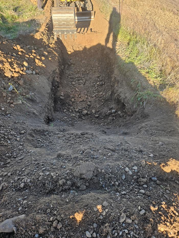 Facing east. Excavation has begun. I dug down a layer before adding wood for the extra soil