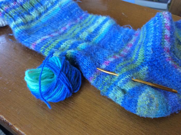 Holey sock (hole just below needle), darning needle, reasonably matchy sock yarn.