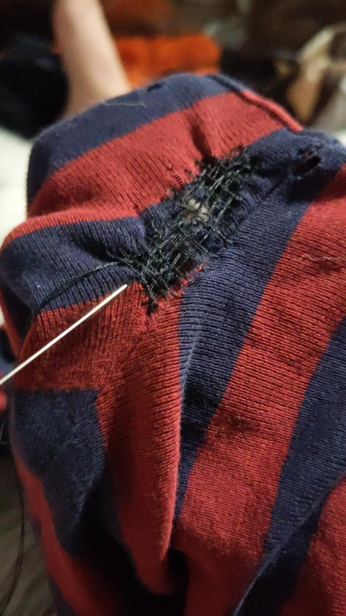 mending a hole in a t-shirt