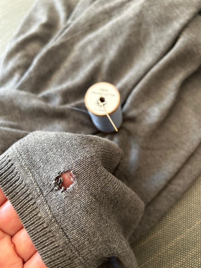 Sweater with hole in the back of the neck