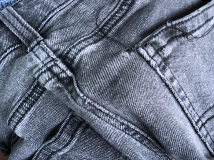 half-finished darning of hole in jeans
