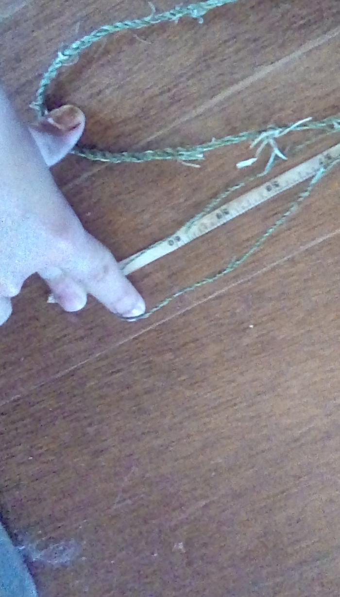 That is five feet of measuring tape and the twine folded four times