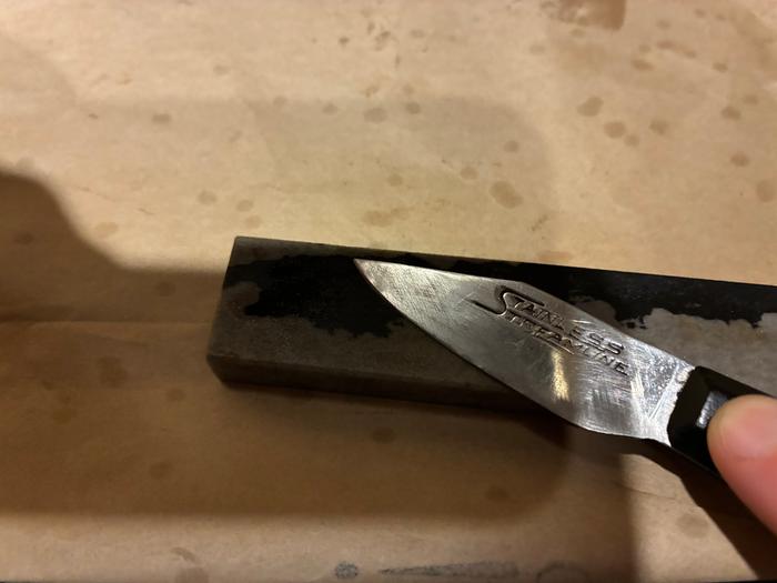 honing in progress with small whetstone