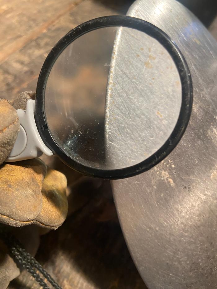 magnifying glass view of a dull shovel