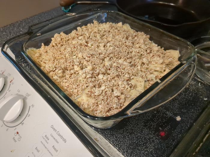 Top with chopped pecans and breadcrumbs.