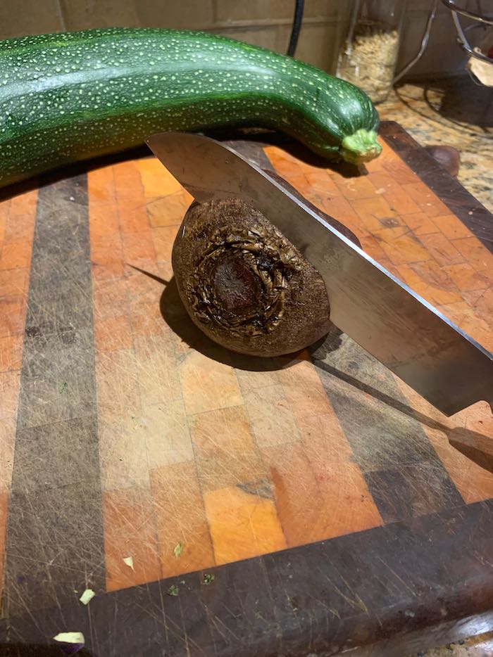 Beet on cutting board, with knife